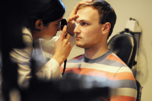 Students worked with faculty from the Department of Ophthalmology to practice eye examinations on standardized patients.