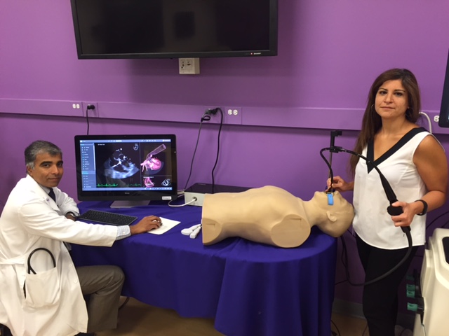 Jyothy Puthumana, MD, (left) associate professor of medicine, and Zeina Ibrahim, advanced imaging fellow, use a specialized echocardiography simulator.