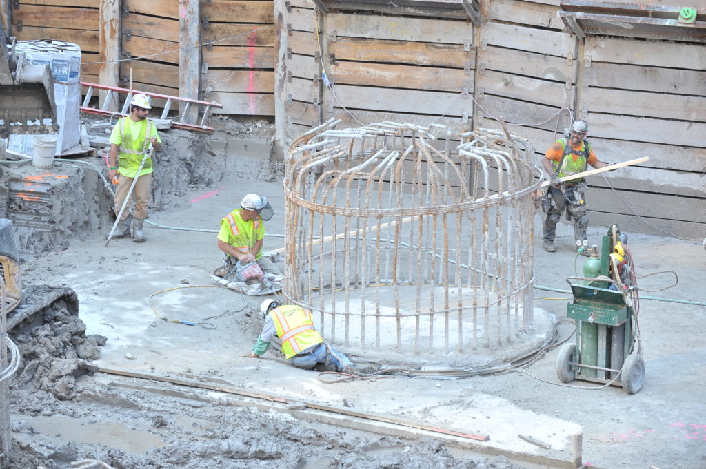 Crews work on installing caissons to support the structural steel of the Simpson Querrey Biomedical Research Center.