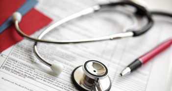 Race Ranks Higher Than Pounds in Diabetes, Heart-Health Risks Stethoscope and pen resting on medical examination notes or patient record form
