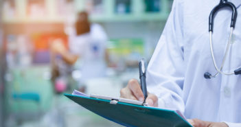 Comparing Quality at Veterans and Civilian Hospitals Doctor writing a medical prescription in hospital