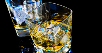 Reversing Fetal Alcohol Damage After Birth top of view of glass of whiskey on black table