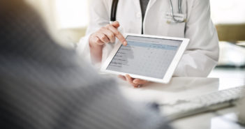 Tracking Quality of Life During Prostate Cancer Treatment Shot of a doctor showing a senior patient some information on a digital tablet in her office