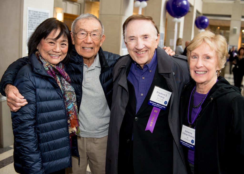 Bradford Prokop, '57 MD, center, and wife Adrienne Vollmer Prokop '58, right, reconnected with former classmates in Method Atrium.