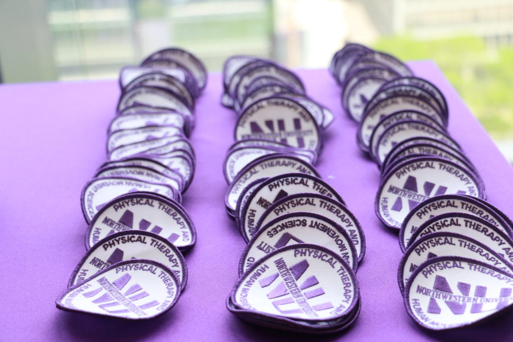 At the Doctor of Physical Therapy Program's Clinical Practice Ceremony, celebrating the transition from the program’s first year of classroom instruction to its second year of clinical practice, students are presented with patches for their white coats.