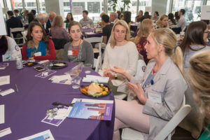 Laura Frese, ’16 PA-C (gray coat), dispenses advice to Physician Assistant (PA) Program students at the mentoring lunch. (Photo credit: Randy Belice for Northwestern University) 