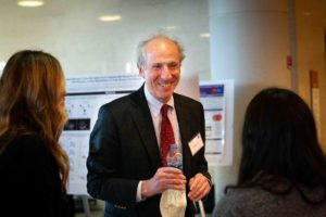 Robert Kalb, MD, the Joan and Paul Rubschlager Professor of Neurology, chief of Neuromuscular Disease in the Department of Neurology and director of the Les Turner ALS Center, speaks with scientists presenting their research at the Les Turner Symposium on ALS.