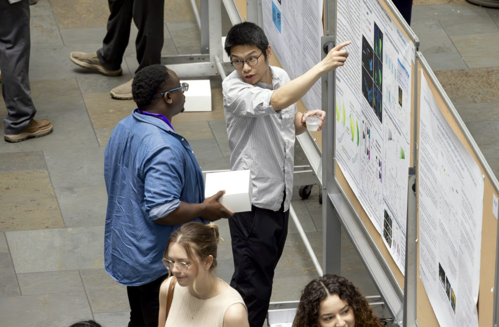 Attendees at a research poster session showcased ongoing research into causes of and potential treatments for Alzheimer’s Disease. Photo: Theresa Crawford