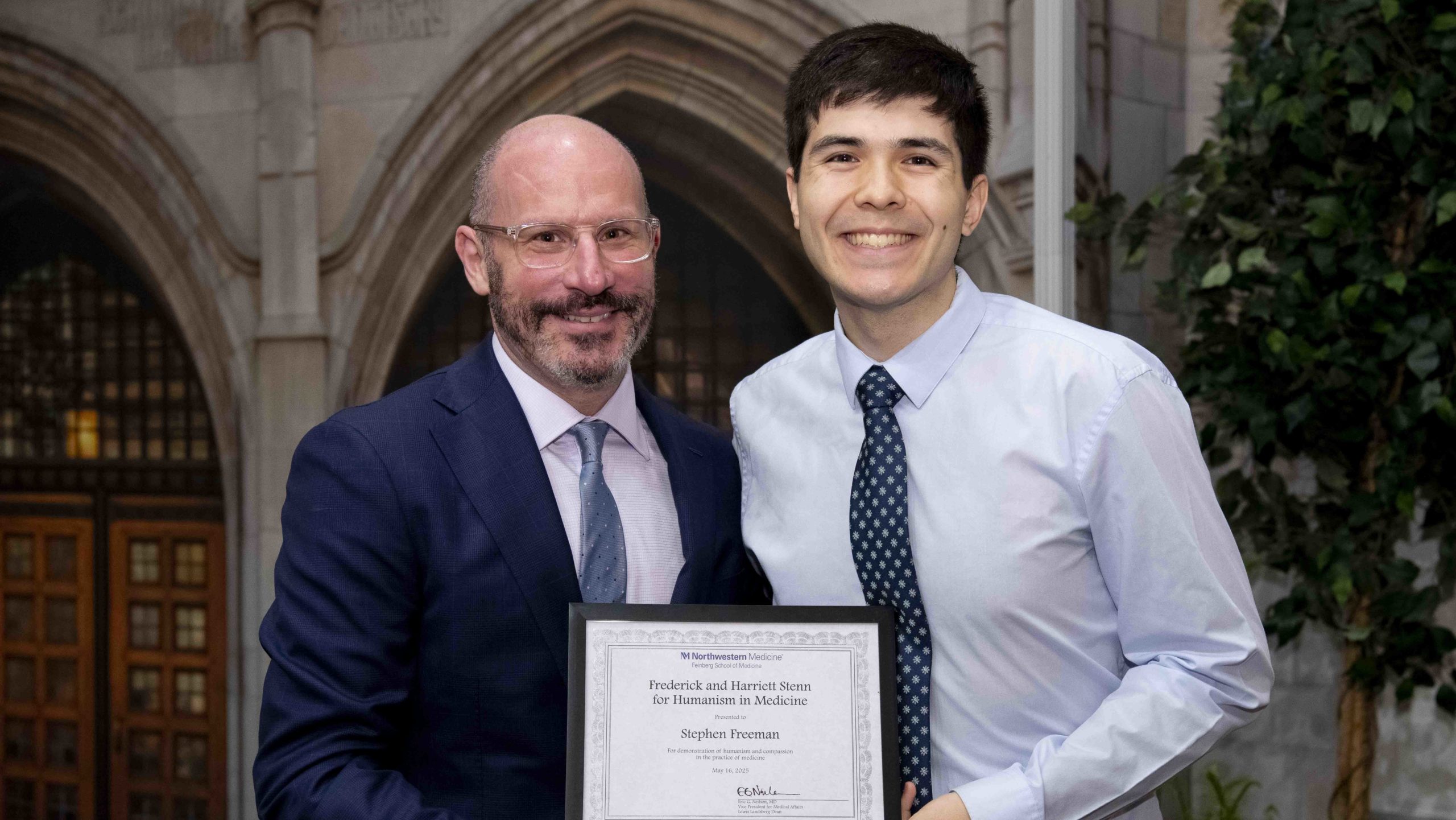 Fourth-year medical student Stephen Freeman (right) was awarded the Frederick and Harriett Stenn Award for Humanism in Medicine by Eli Zimmerman, MD, associate dean for Student Affairs. Photo: Nathan Mandell