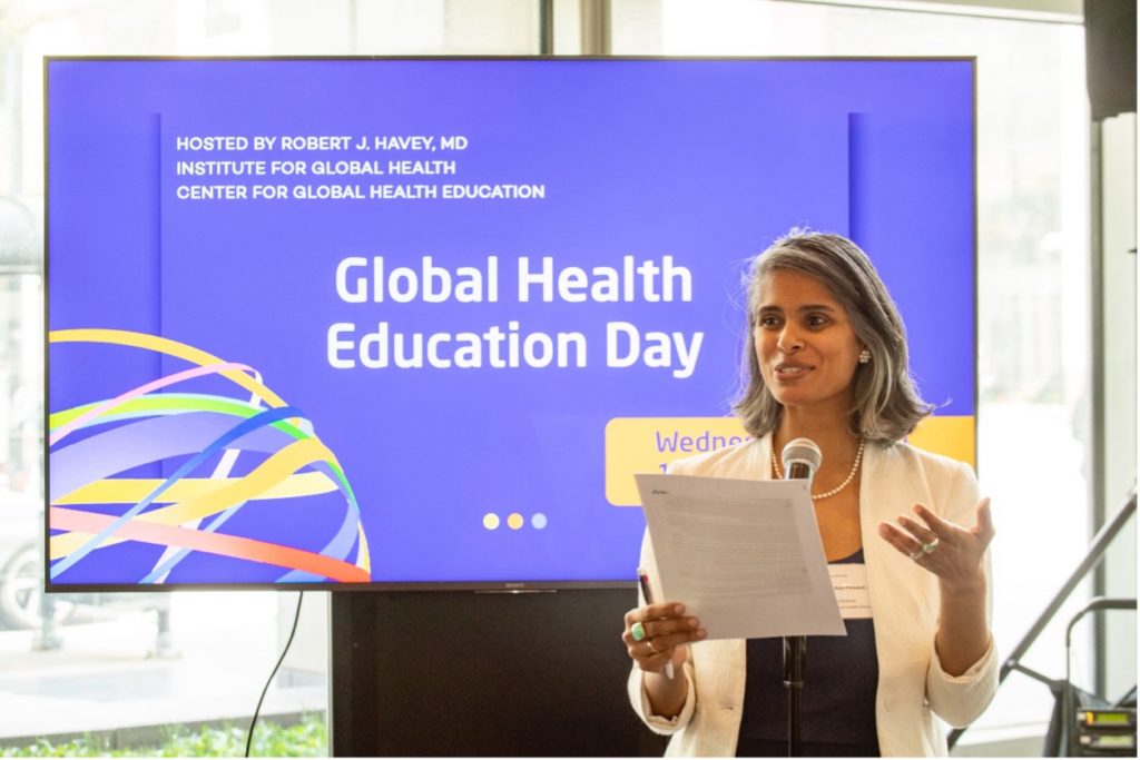 Ashti Doobay-Persaud, MD, welcomes attendees to Global Health Education Day during her opening remarks in the Ryan Family Atrium. Photo: Randy Belice
