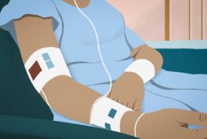 A depiction of a patient receiving chemotherapy treatment at a clinic.