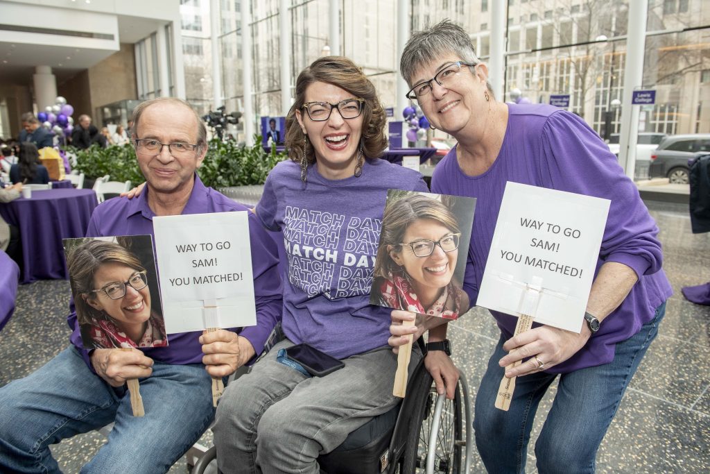 Samantha Schroth, who matched into a combined pediatrics and physical medicine and rehabilitation program at Ann & Robert H. Lurie Children's Hospital of Chicago and Shirley Ryan AbilityLab, poses for a photo with her family.