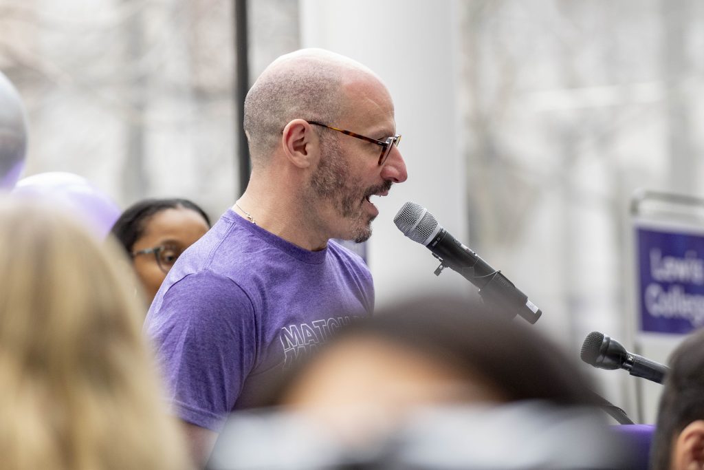Eli Zimmerman, MD, speaks at a podium.
