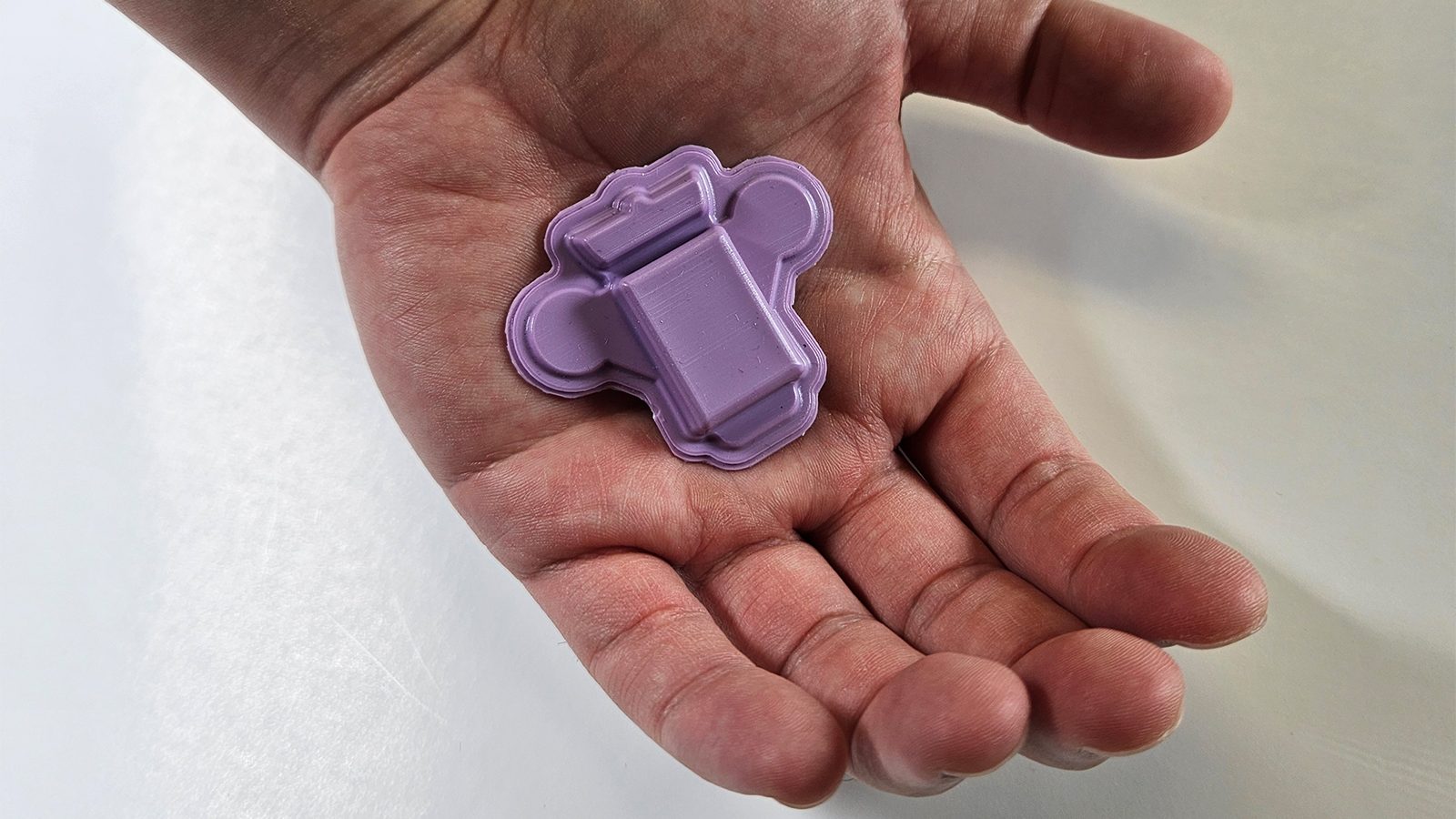 Wearable polygraph device in the palm of a hand for scale. (John A. Rogers/Northwestern University)