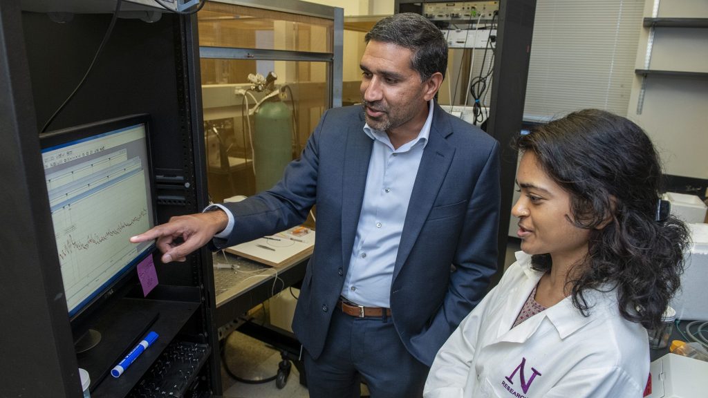 Study authors Sachin Patel, MD, PhD, (left) and Farhana Yasmin, PhD, looking at brain recordings from central amygdala neurons.